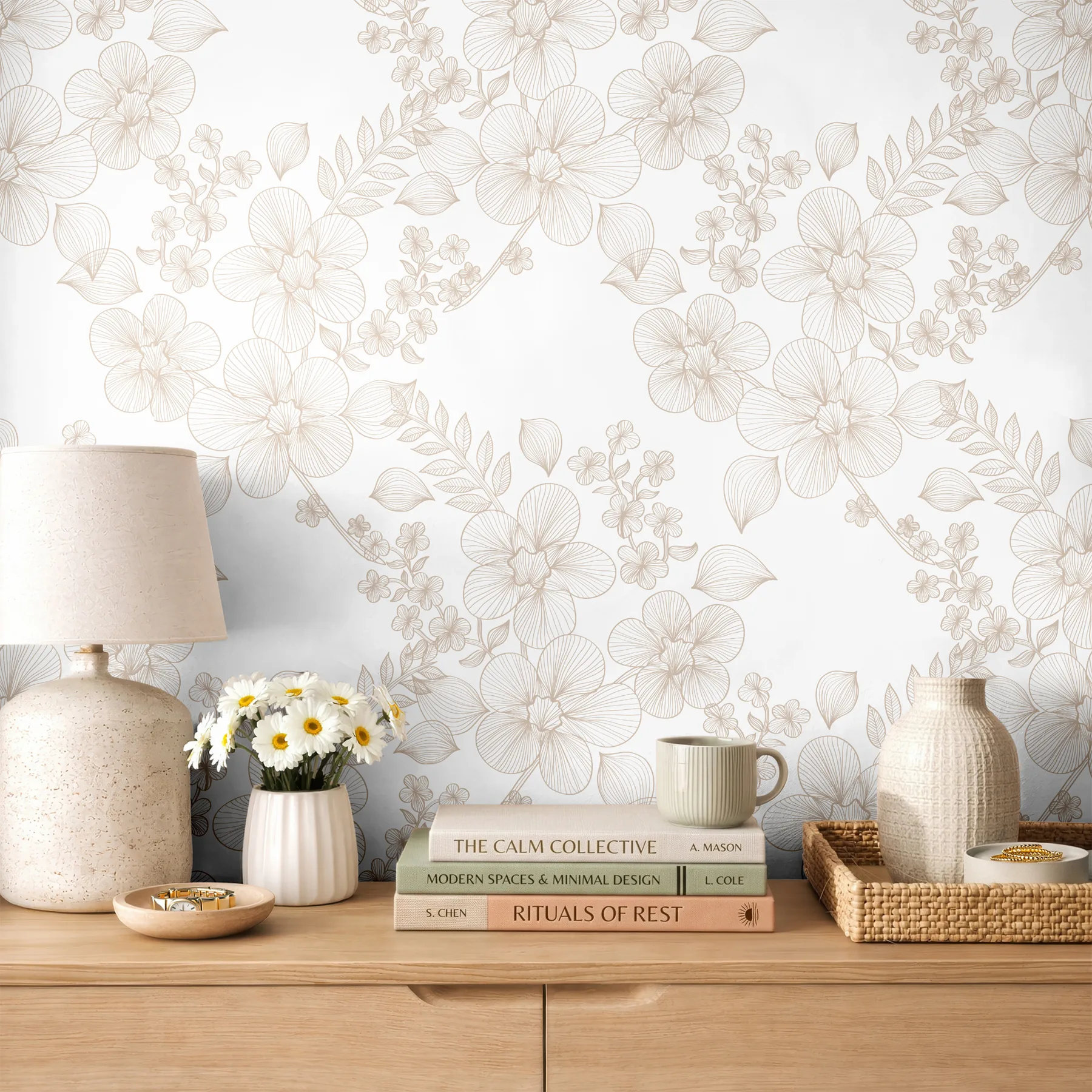 Light-filled interior with delicate floral wallpaper and a simple styled console